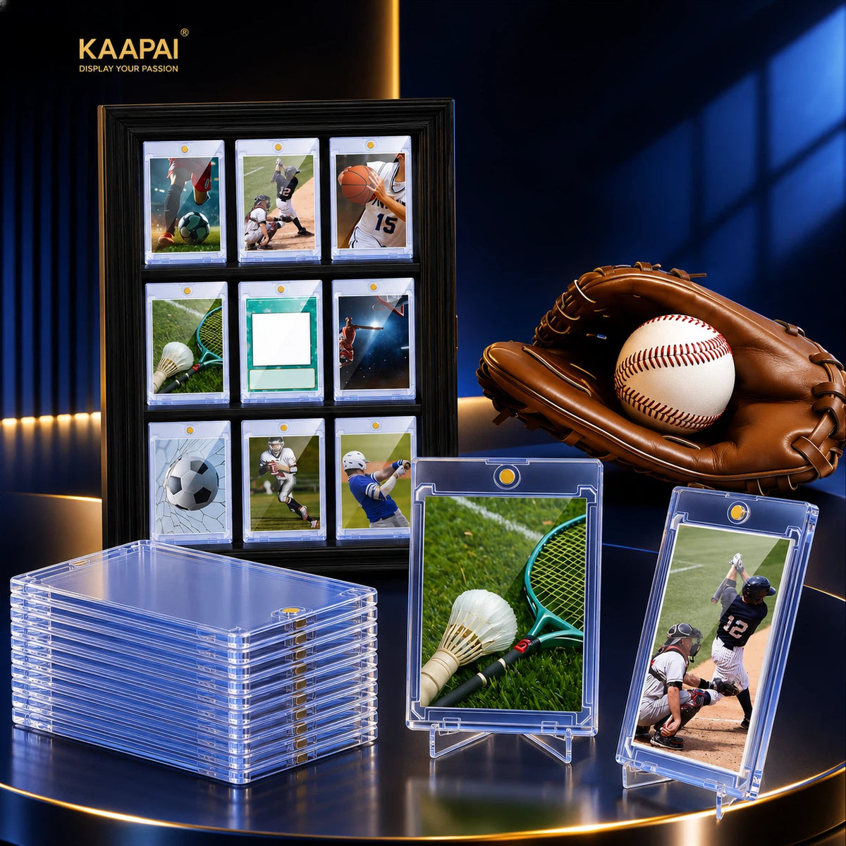 A display of KAAPAI baseball and sports memorabilia photo frames and protective sleeves. The set includes a large black frame with a 3x4 grid of sample sports photos, a stack of clear plastic sleeves, two individual clear sleeves on stands showing a badminton court scene and a baseball game scene, and a brown leather baseball glove holding a baseball on a dark blue background.