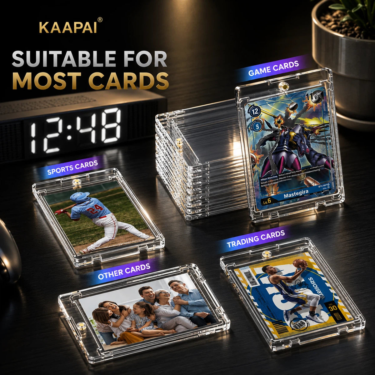 Clear acrylic card protectors shown on a dark tabletop, including one stack of empty clear cases, one baseball card case with a baseball player photo, one game cards case with a Gundam card, one sports cards case with a baseball player photo, and one trading cards case with a baseball player photo. The text 'KAAPAI' and 'SUITABLE FOR MOST CARDS' appears on the image.