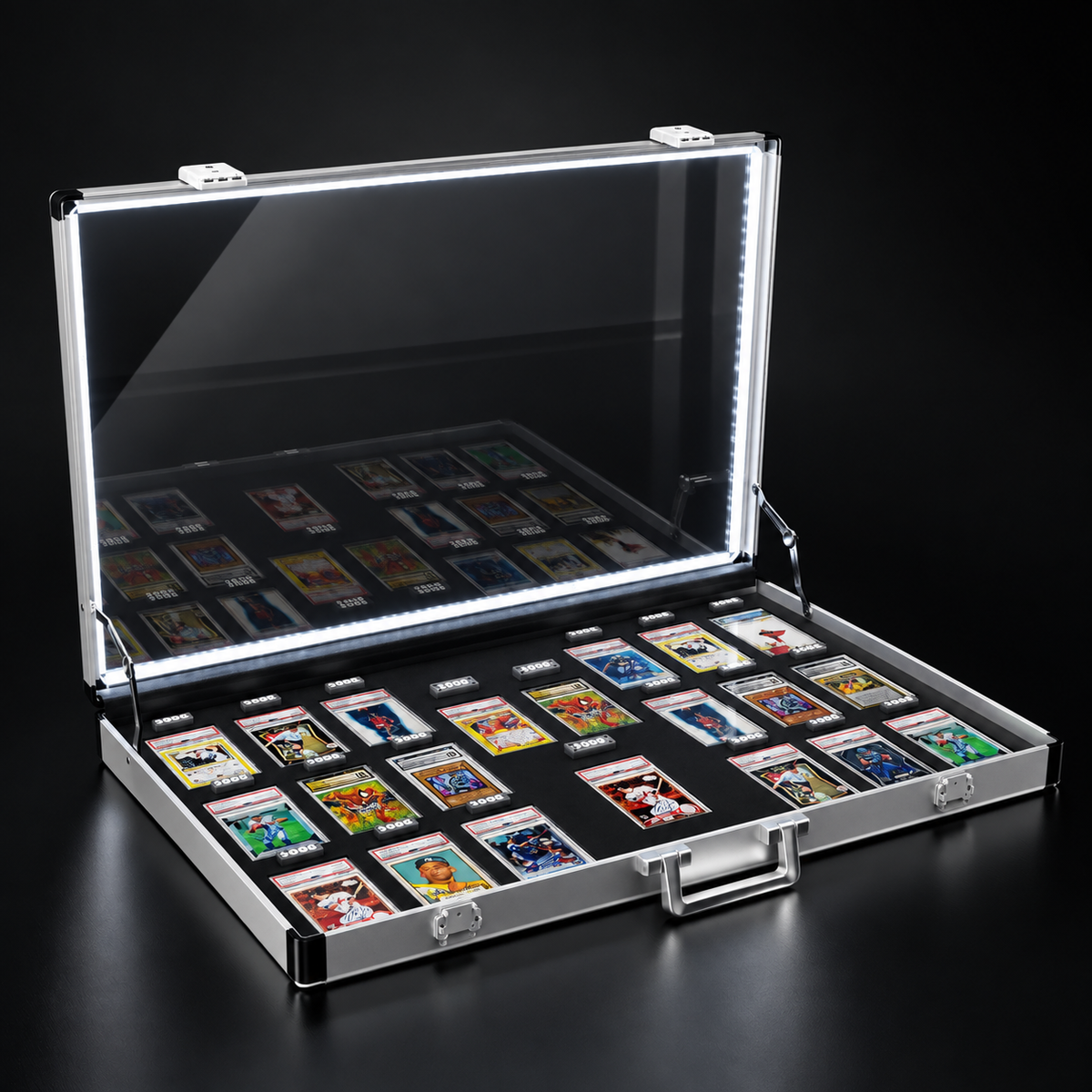 An open silver aluminum card display case with a clear lid illuminated by built-in LED lighting, filled with collectible trading cards on a black background.