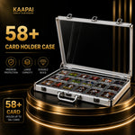 An open KAAPAI aluminum card holder case with a clear lid, displayed on a glowing black pedestal. The case contains multiple rows of card sleeves holding collectible cards.